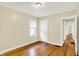 Bedroom with hardwood flooring, natural light, and a neutral color palette at 1411 N Linwood Ave, Indianapolis, IN 46201