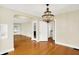 Bright dining room with hardwood floors and a decorative chandelier at 1411 N Linwood Ave, Indianapolis, IN 46201