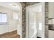 Hallway featuring archway, doors, and access to the Laundry Room at 1411 N Linwood Ave, Indianapolis, IN 46201