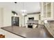Kitchen features stainless steel appliances, stone backsplash, and an island at 1411 N Linwood Ave, Indianapolis, IN 46201