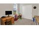 Bedroom with a desk, a window with blinds and toys scattered on the floor at 1460 Boots Trl, Greenfield, IN 46140