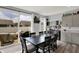 Well-lit dining area with a large sliding glass door to the patio and view of the backyard at 1460 Boots Trl, Greenfield, IN 46140