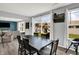 The dining area features a sliding glass door to the yard, a view of the living area, and neutral paint at 1460 Boots Trl, Greenfield, IN 46140