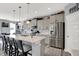 Bright kitchen with gray cabinets, stainless steel appliances, and a large island with seating at 1460 Boots Trl, Greenfield, IN 46140