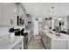 Modern kitchen with gray cabinets, stainless steel appliances, and a center island with plenty of counter space at 1460 Boots Trl, Greenfield, IN 46140
