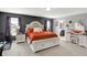 Main bedroom with white furniture, a seating bench, and ensuite bath access at 1460 Boots Trl, Greenfield, IN 46140