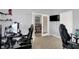 Spacious office featuring a gaming chair and multiple computer monitors, ideal for a home workstation at 1460 Boots Trl, Greenfield, IN 46140