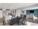 View of the open floorplan, including a kitchen island, dining table, and living area with a TV at 1460 Boots Trl, Greenfield, IN 46140