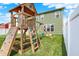 The backyard playset includes climbing wall and swings, great for outdoor fun and recreation at 1460 Boots Trl, Greenfield, IN 46140