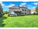 Expansive brick home with large backyard, outdoor living space, and mature landscaping at 14737 Macduff Dr, Noblesville, IN 46062