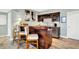 Finished basement with a dark wood bar, white barstools, and modern light fixtures at 14737 Macduff Dr, Noblesville, IN 46062