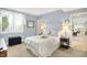 Comfortable bedroom with light blue walls, a plush bed, and lots of natural light at 14737 Macduff Dr, Noblesville, IN 46062