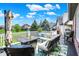 Beautiful deck with outdoor seating, a fire pit table, and lovely views of the property at 14737 Macduff Dr, Noblesville, IN 46062