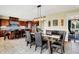 Open concept dining area with table, chairs, buffet, and view into the adjacent kitchen at 14737 Macduff Dr, Noblesville, IN 46062