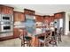 Gourmet kitchen with custom cabinets, stainless steel appliances, and a center island with bar seating at 14737 Macduff Dr, Noblesville, IN 46062