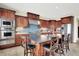 Gourmet kitchen with custom cabinetry, stainless steel appliances, and a large center island at 14737 Macduff Dr, Noblesville, IN 46062