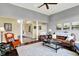 Expansive living room with hardwood floors, columns, comfortable seating, and an open layout at 14737 Macduff Dr, Noblesville, IN 46062