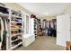 Spacious walk-in closet with built-in shelving, window seat, and ample storage for clothes and accessories at 14737 Macduff Dr, Noblesville, IN 46062