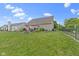 Spacious backyard features a deck, fire pit, and lush green grass, perfect for outdoor entertaining at 15372 Black Gold Ct, Noblesville, IN 46060