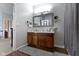 Well-lit bathroom with double vanity, hardwood floors, and a shower-tub with shower curtain at 15372 Black Gold Ct, Noblesville, IN 46060