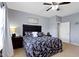 Comfortable bedroom features soft carpet, a ceiling fan, and an ensuite door to the bathroom at 15372 Black Gold Ct, Noblesville, IN 46060