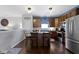 Open kitchen featuring an island with seating, stainless steel appliances, and ample cabinet space at 15372 Black Gold Ct, Noblesville, IN 46060