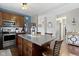 Well-appointed kitchen featuring stainless steel appliances, a center island, and warm wood cabinetry at 15372 Black Gold Ct, Noblesville, IN 46060