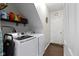 Bright laundry room with shelving, washer and dryer, and access door at 15372 Black Gold Ct, Noblesville, IN 46060