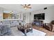 Spacious living room with an open-concept design that connects seamlessly to the adjacent kitchen at 15372 Black Gold Ct, Noblesville, IN 46060