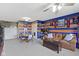 Spacious carpeted basement with colorful walls, couch, and plenty of room at 15372 Black Gold Ct, Noblesville, IN 46060