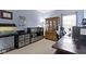 Office with neutral walls and carpeting, large desk, display cabinet and multiple storage solutions at 15372 Black Gold Ct, Noblesville, IN 46060