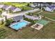Aerial view of community pool, playground and basketball court surrounded by neighborhood homes at 15984 Conductors Dr, Westfield, IN 46074