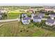 Aerial perspective of a two-story residence set in a suburban community with green spaces and tree-lined streets at 15984 Conductors Dr, Westfield, IN 46074