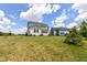 Expansive backyard with a well-maintained lawn and exterior view of the two-story home, perfect for outdoor activities at 15984 Conductors Dr, Westfield, IN 46074