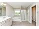 Bright bathroom features a soaking tub, glass shower, and wood-look tile flooring at 15984 Conductors Dr, Westfield, IN 46074