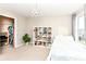 Bedroom has bookshelves, a chandelier, and a window providing natural light at 15984 Conductors Dr, Westfield, IN 46074