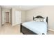 Well-lit bedroom featuring neutral walls and carpet, along with a window to let natural light in at 15984 Conductors Dr, Westfield, IN 46074