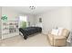 Bright bedroom boasts a soccer themed light, shelving and a cozy chair by the window at 15984 Conductors Dr, Westfield, IN 46074
