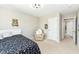 Bedroom with a reading chair, neutral walls and carpet, and a window for natural light at 15984 Conductors Dr, Westfield, IN 46074