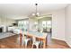 Inviting dining area with unique table, open to the living room and study space at 15984 Conductors Dr, Westfield, IN 46074