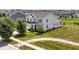 Gorgeous suburban home featuring lush landscaping, mature trees, and an attached two-car garage at 15984 Conductors Dr, Westfield, IN 46074