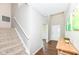 Inviting foyer with hardwood floors, staircase, and neutral paint, creating a warm welcome at 15984 Conductors Dr, Westfield, IN 46074