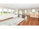 Spacious living room with large windows, hardwood floors, and an open layout at 15984 Conductors Dr, Westfield, IN 46074