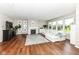 Cozy living room featuring a fireplace, hardwood floors, and abundant natural light at 15984 Conductors Dr, Westfield, IN 46074