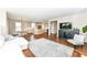 Open-concept living room showcasing hardwood floors and seamless flow to the kitchen at 15984 Conductors Dr, Westfield, IN 46074