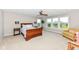 Bright primary bedroom featuring a large window, ceiling fan and a sitting area at 15984 Conductors Dr, Westfield, IN 46074