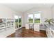 Bright study features built-in desks, natural light, and access to an outdoor deck at 15984 Conductors Dr, Westfield, IN 46074