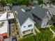 An aerial view showcases a home with front yard landscaping, an inviting entrance and is set within a peaceful, urban neighborhood at 1610 N Alabama St, Indianapolis, IN 46202