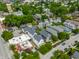 This aerial showcases the property located in a vibrant neighborhood, surrounded by mature trees, and with a strong community at 1610 N Alabama St, Indianapolis, IN 46202