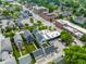 This is an aerial view of a neighborhood with single Gathering houses, apartments, and businesses in a mixed-use area at 1610 N Alabama St, Indianapolis, IN 46202